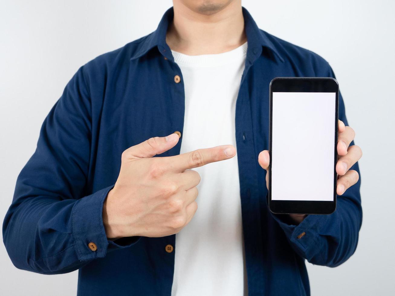 Closeup body of man hand point finger at mobile phone white screen portrait white background photo