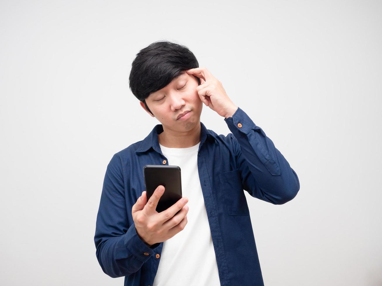 Man holding cell phone and feeling headache white isolated photo