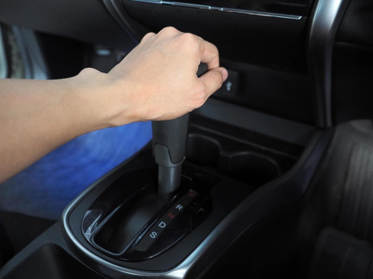 Hand catch at gear auto of car interior the car photo