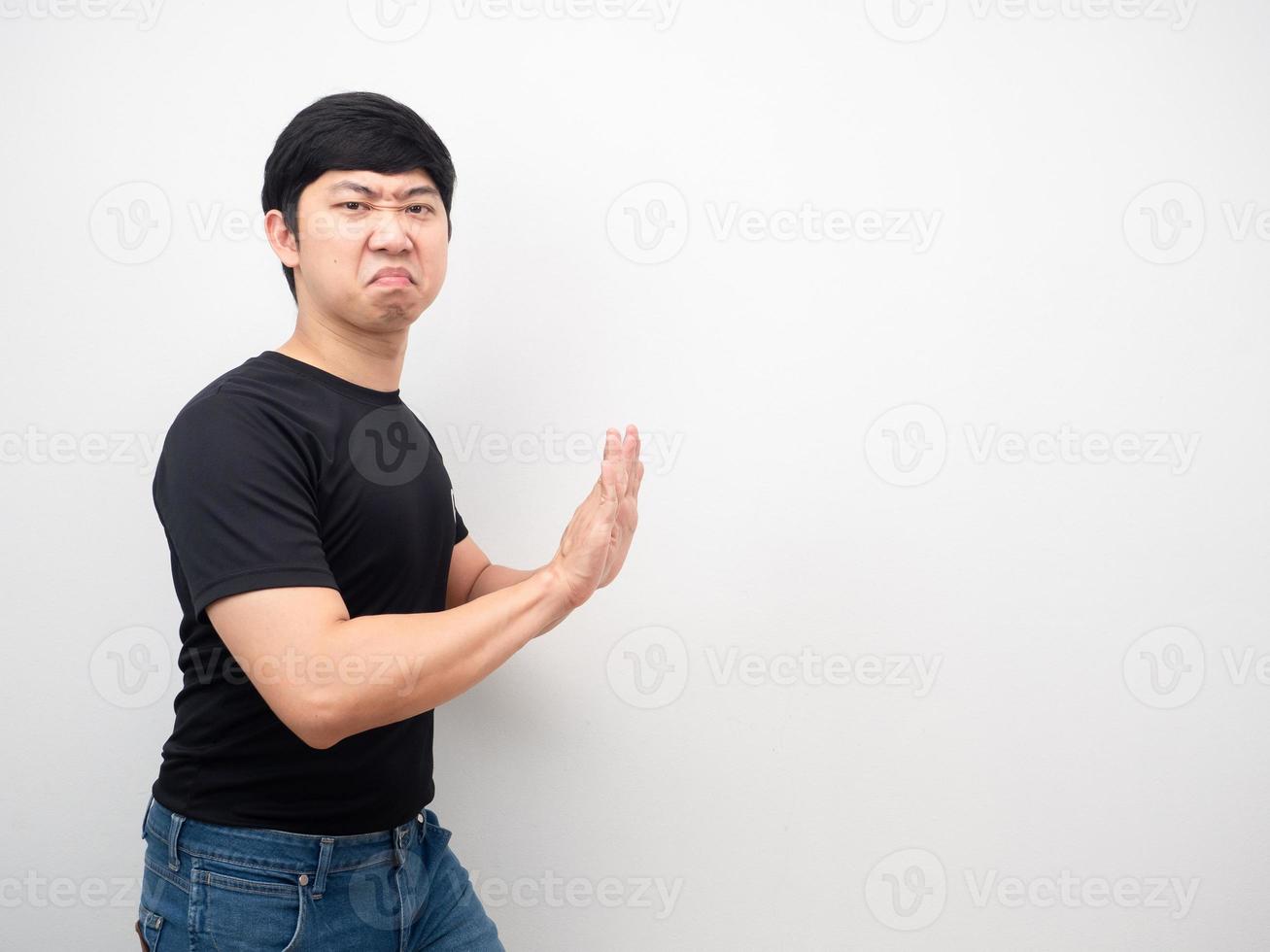 Man black shirt gesture push hand copy space photo