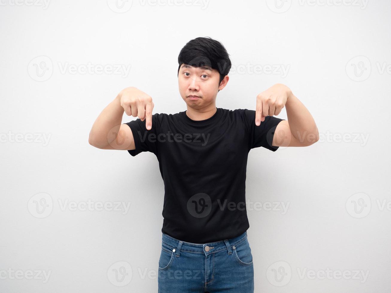 Asian man gesture point finger down photo