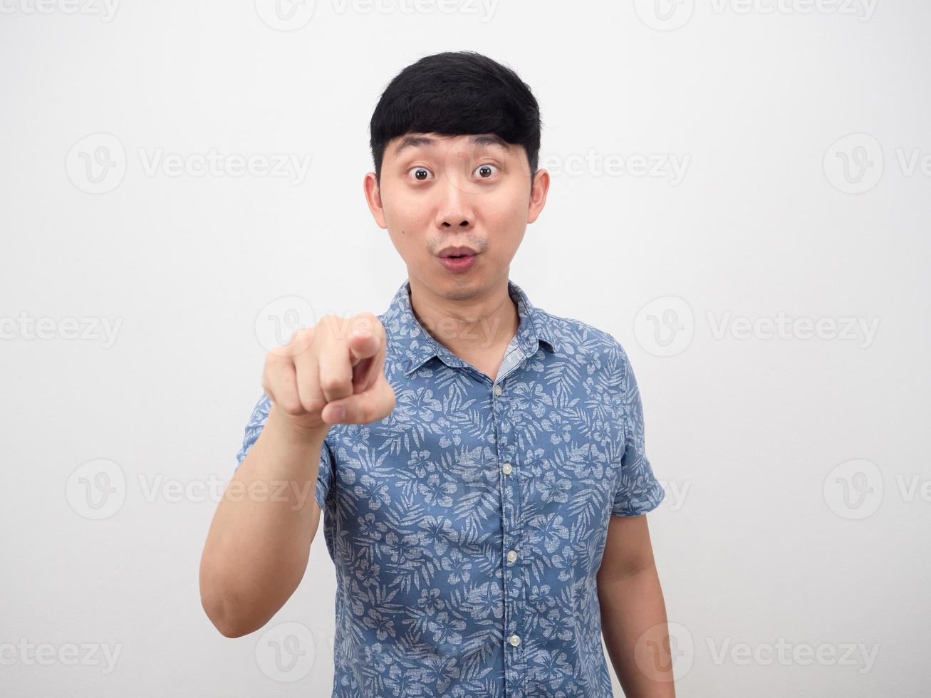 Asian man blue shirt happy smile gesture point finger at you photo