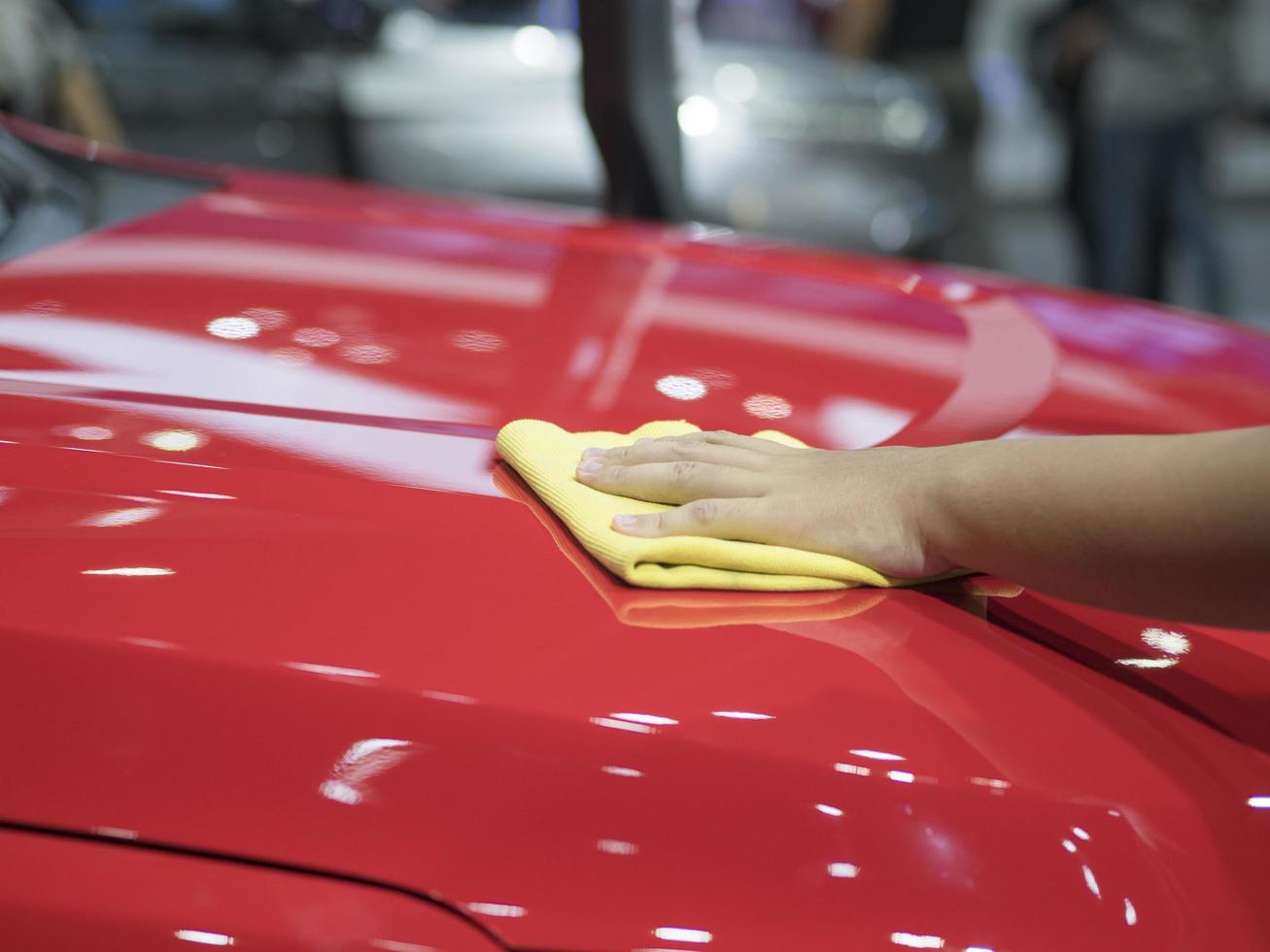 Hand wipe the car shiny clean the new car concept,Hand clean new car photo