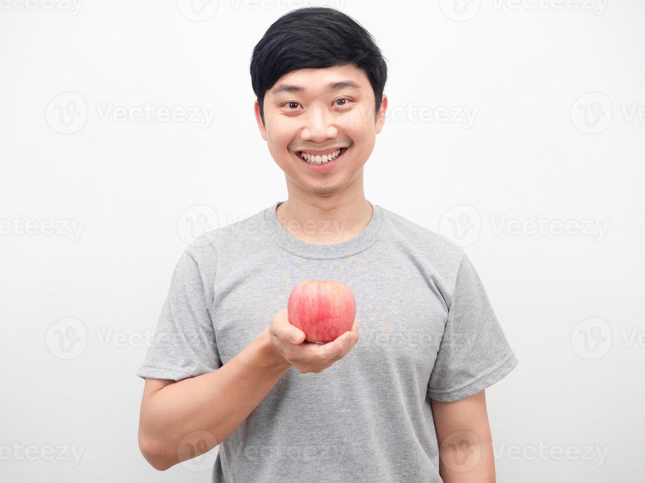 Asian man cheerful smiling holding red apple health concept photo