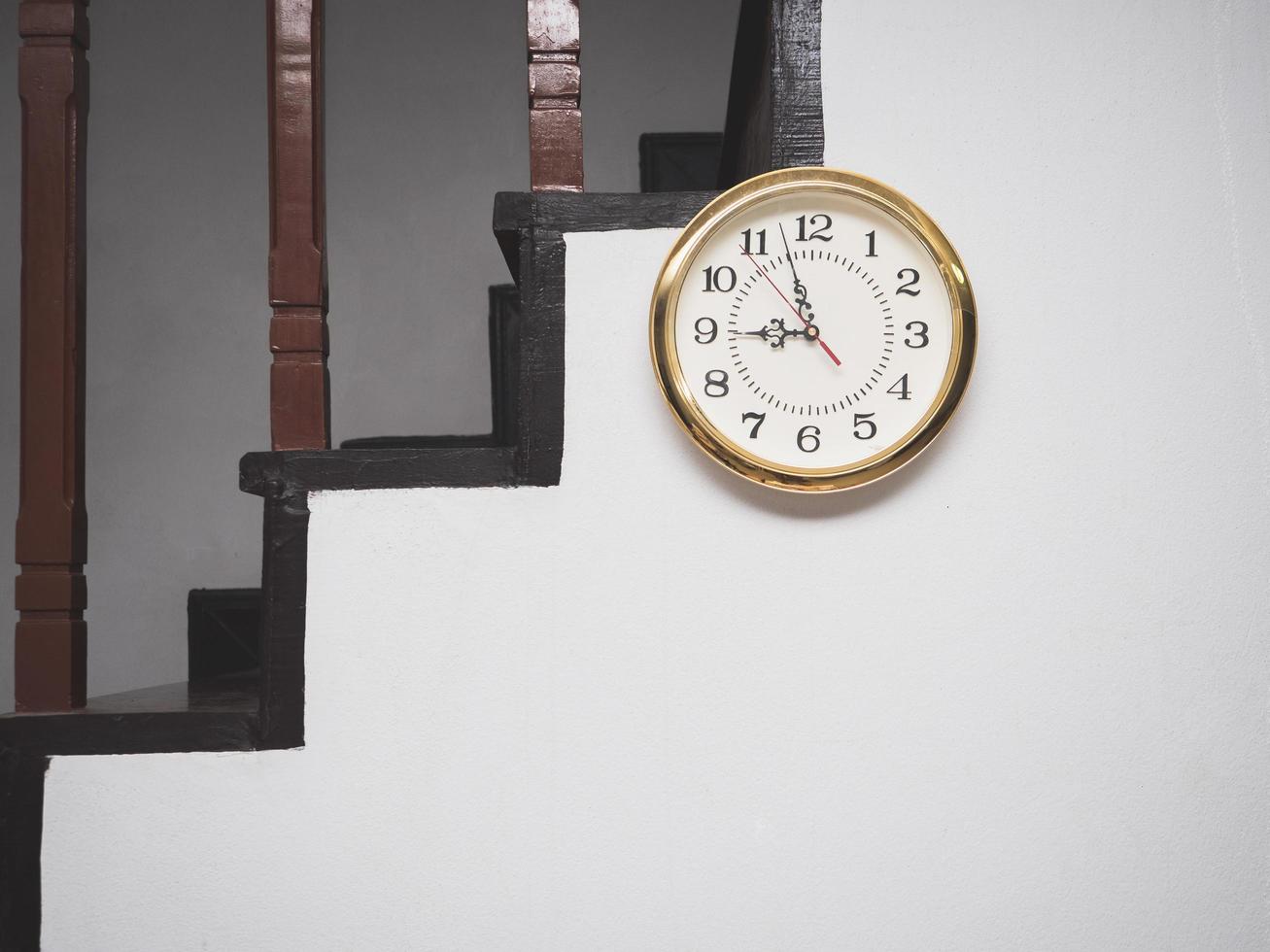 Analog clock at the wall in house photo