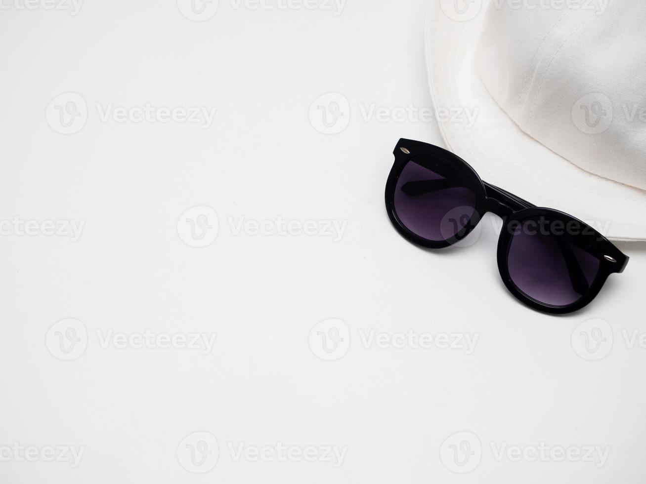 Sunglasses with hat on white isolated holiday concept copy space photo