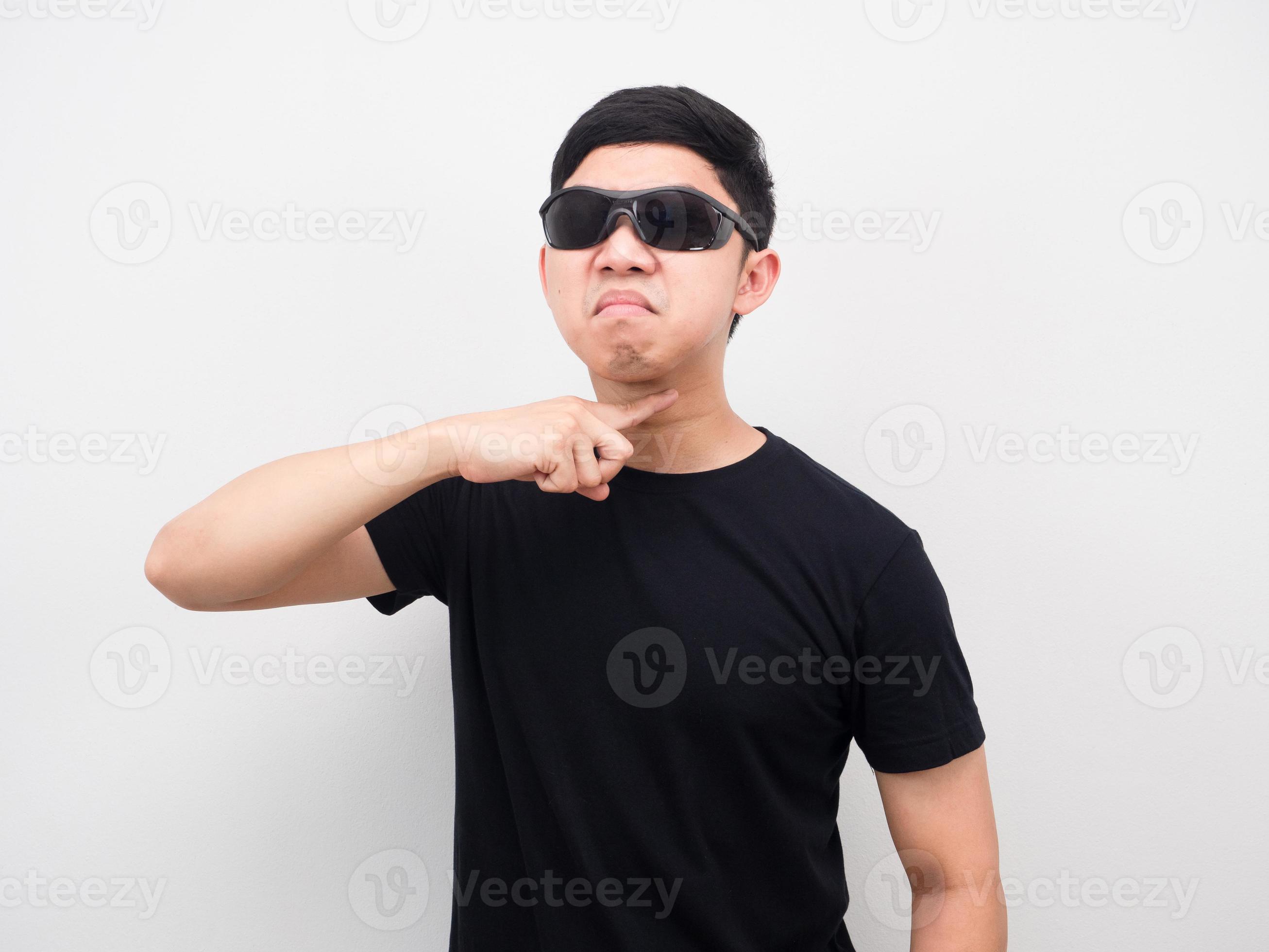 Man wearing sunglasses angry face gesture finger to kill you concept white background 16687017