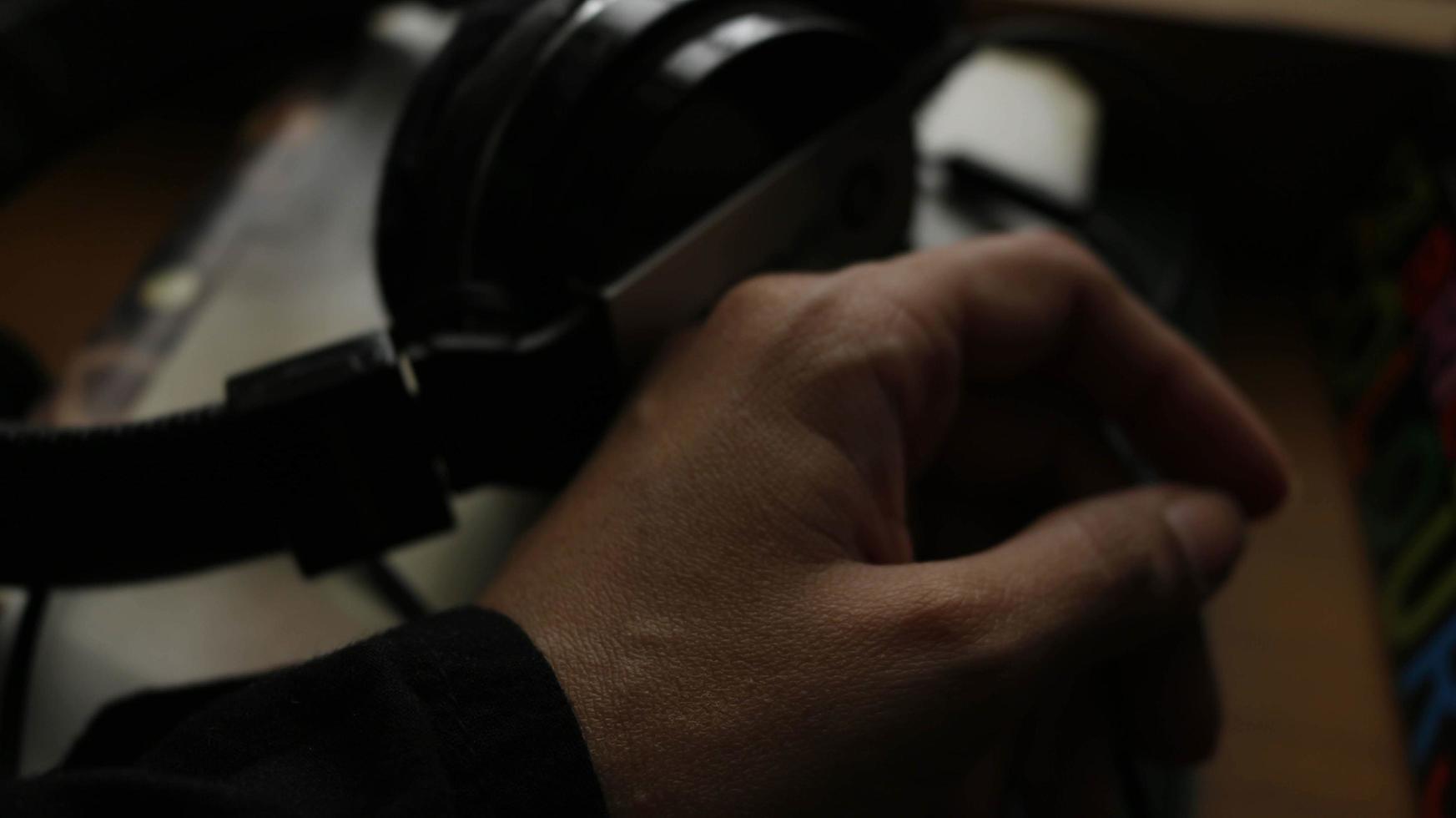 Closeup of a woman's hand on a book in a gloomy setting photo