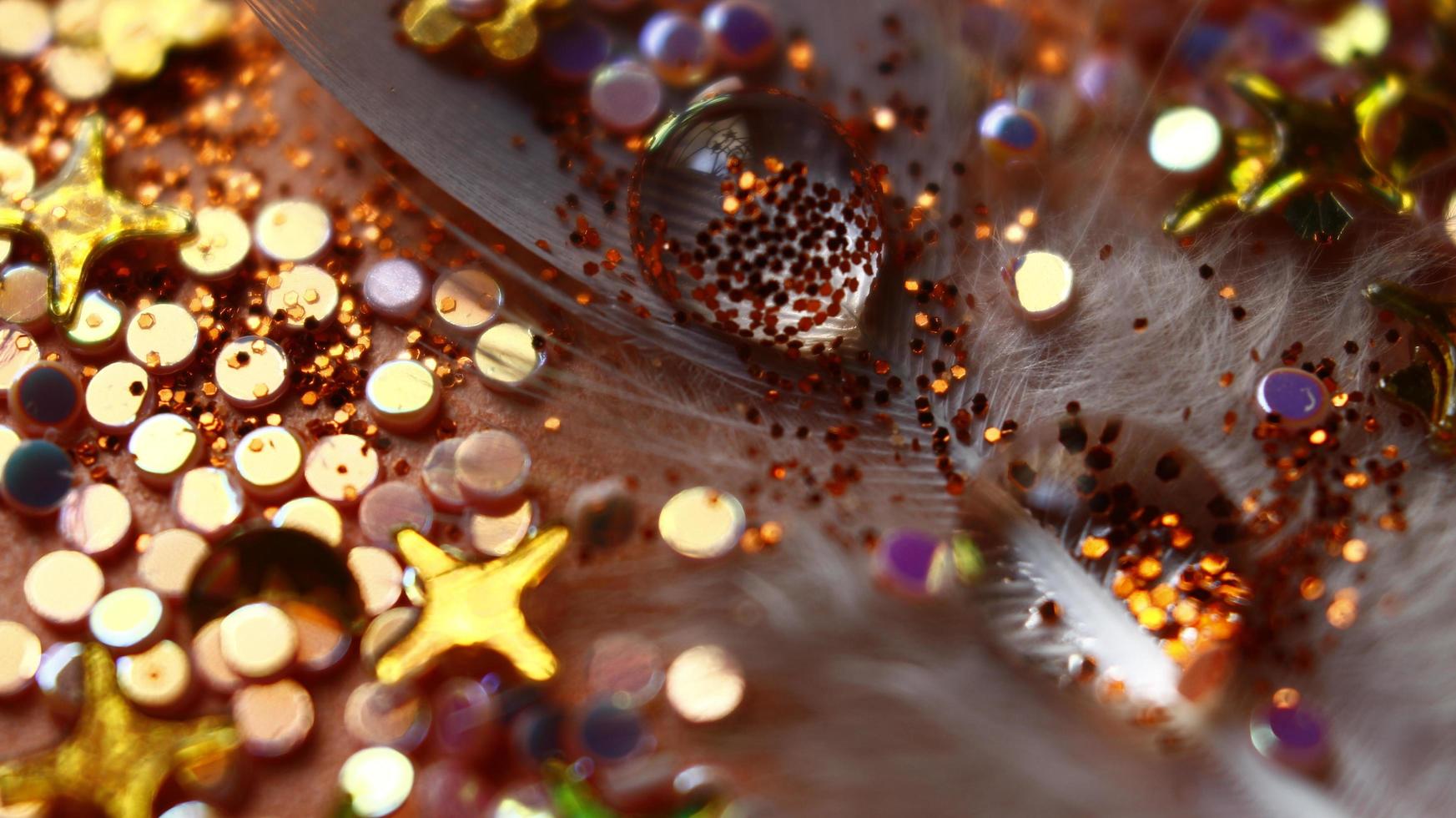 Close-up Of water drop with glitter on it in different colorful loghts in Karachi Pakistan 2022 photo