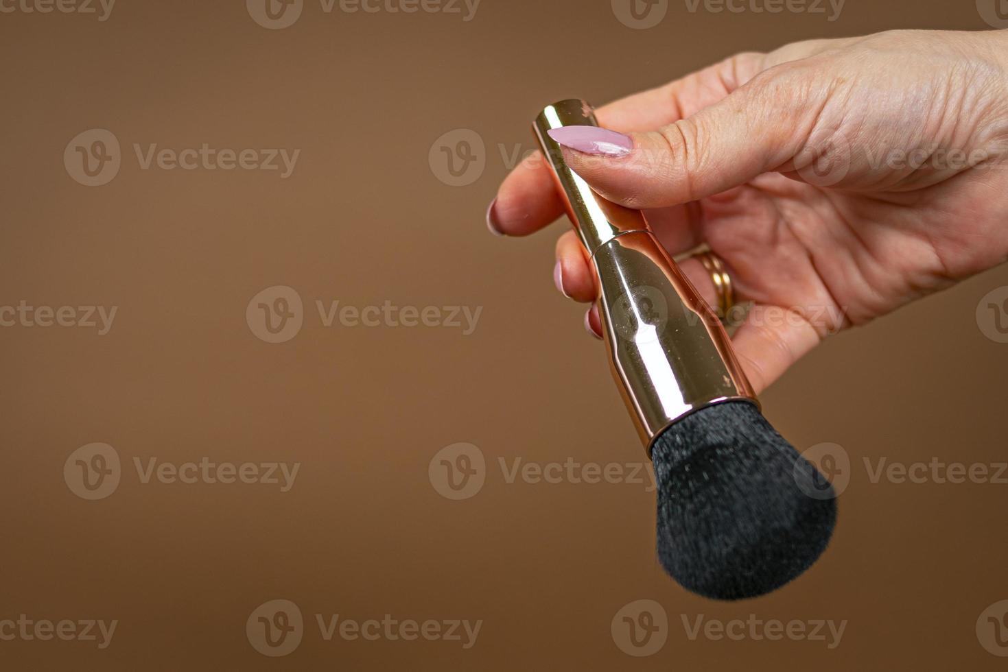 A brush for applying foundation for the face. Elite level cosmetics. A series of shots. Part-1 photo