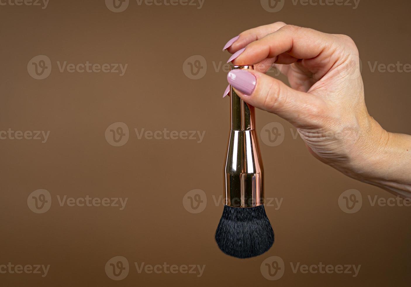 A brush for applying foundation for the face. Elite level cosmetics. A series of shots. Part-5 photo