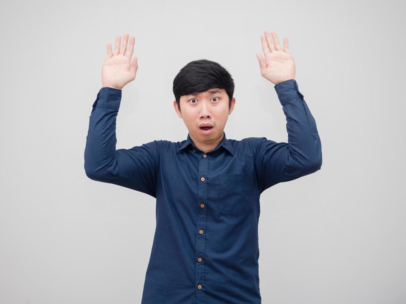 Asian man surrenfer emotion shocked at face show hand up portrait white background photo