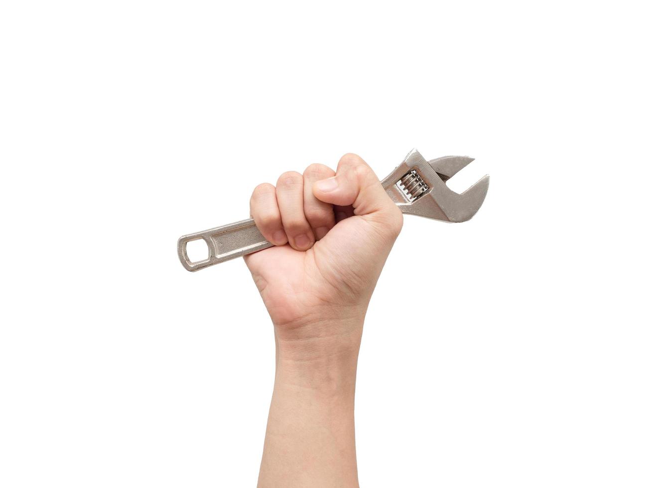 Hand holding adjustable wrench on white isolated background,Labor tool technician photo