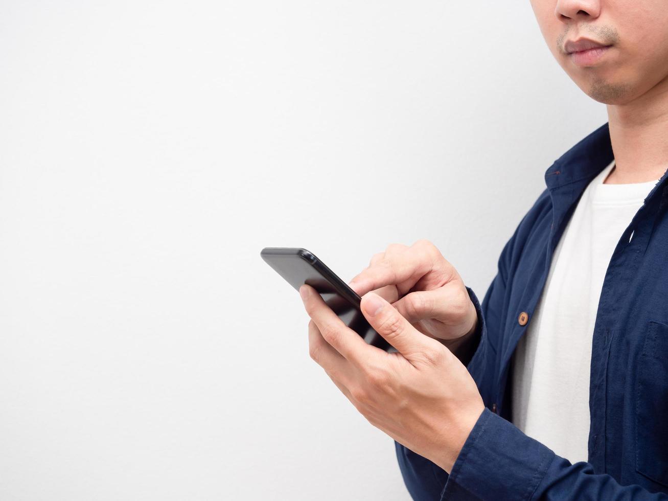 Closeup man using smartphone for shopping look at copy space white background photo