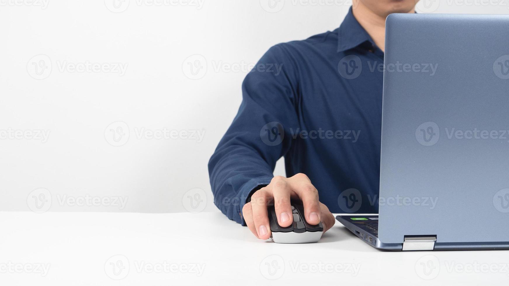 Man hand working with laptop on the table copy space photo