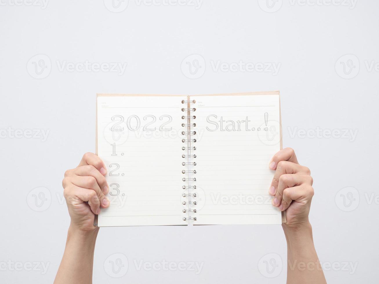 Man hand holding diary blank page isolated photo