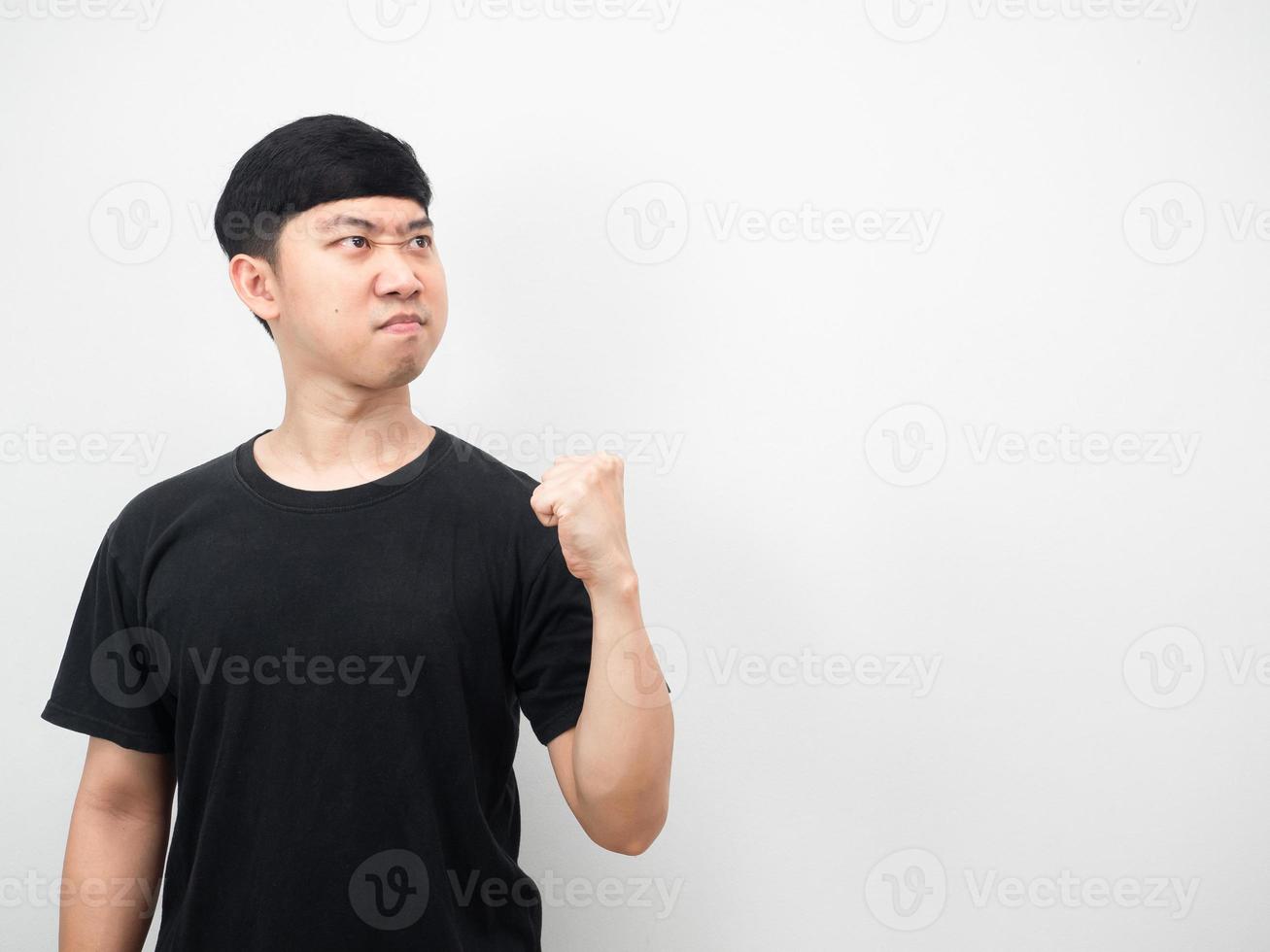 Man show fist up confident face looking at copy space photo