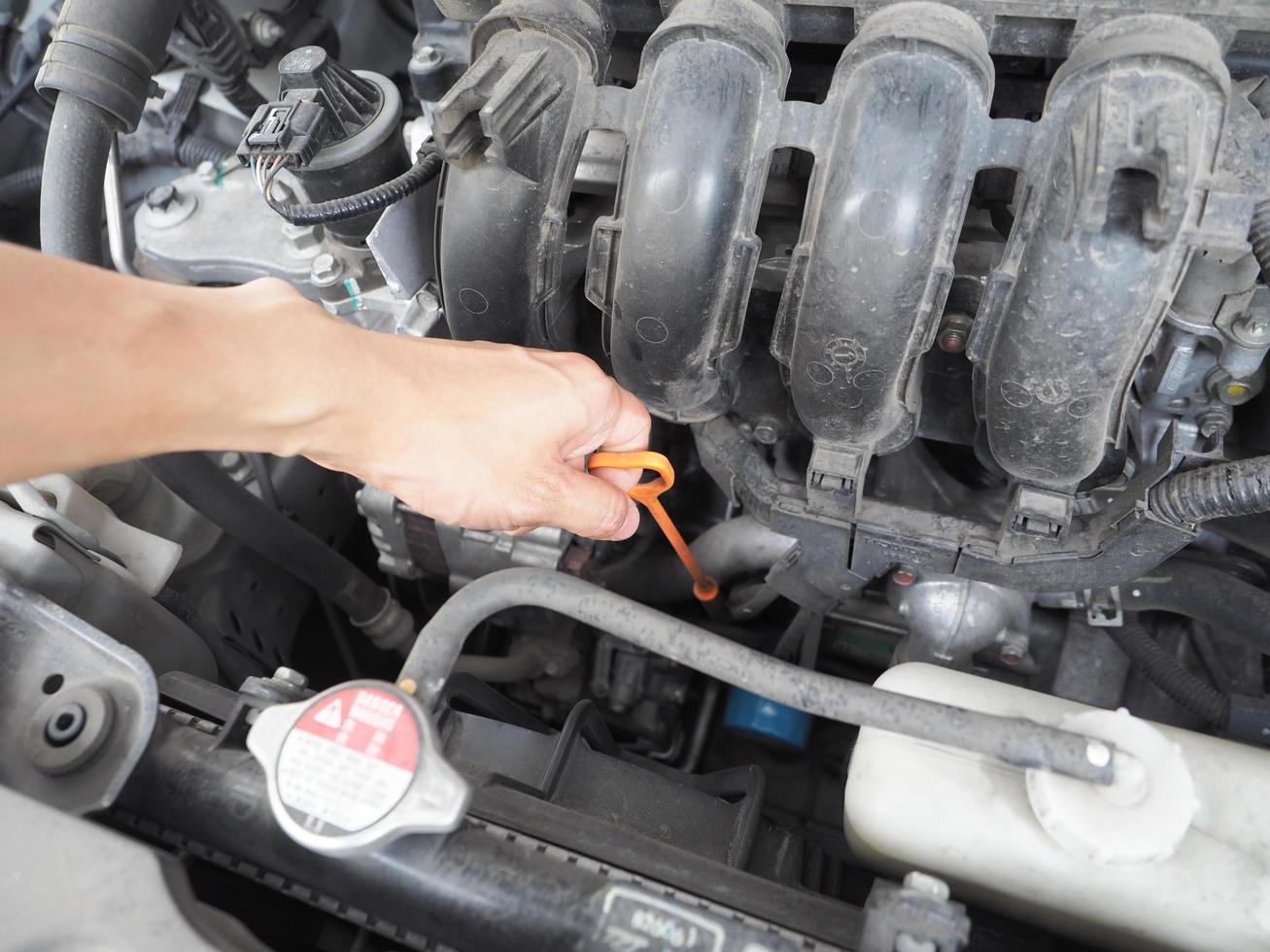 Car maintenance technician checking with car auto engine concept photo