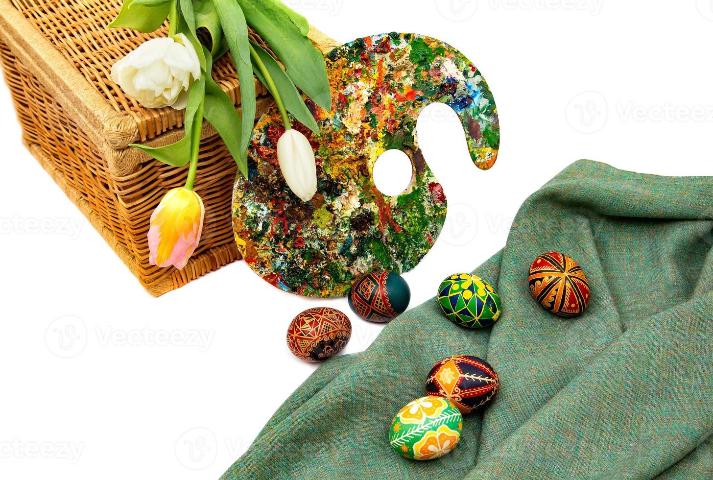 Easter eggs and tulips. Easter eggs with tulips on a white background, easter holiday concept. photo