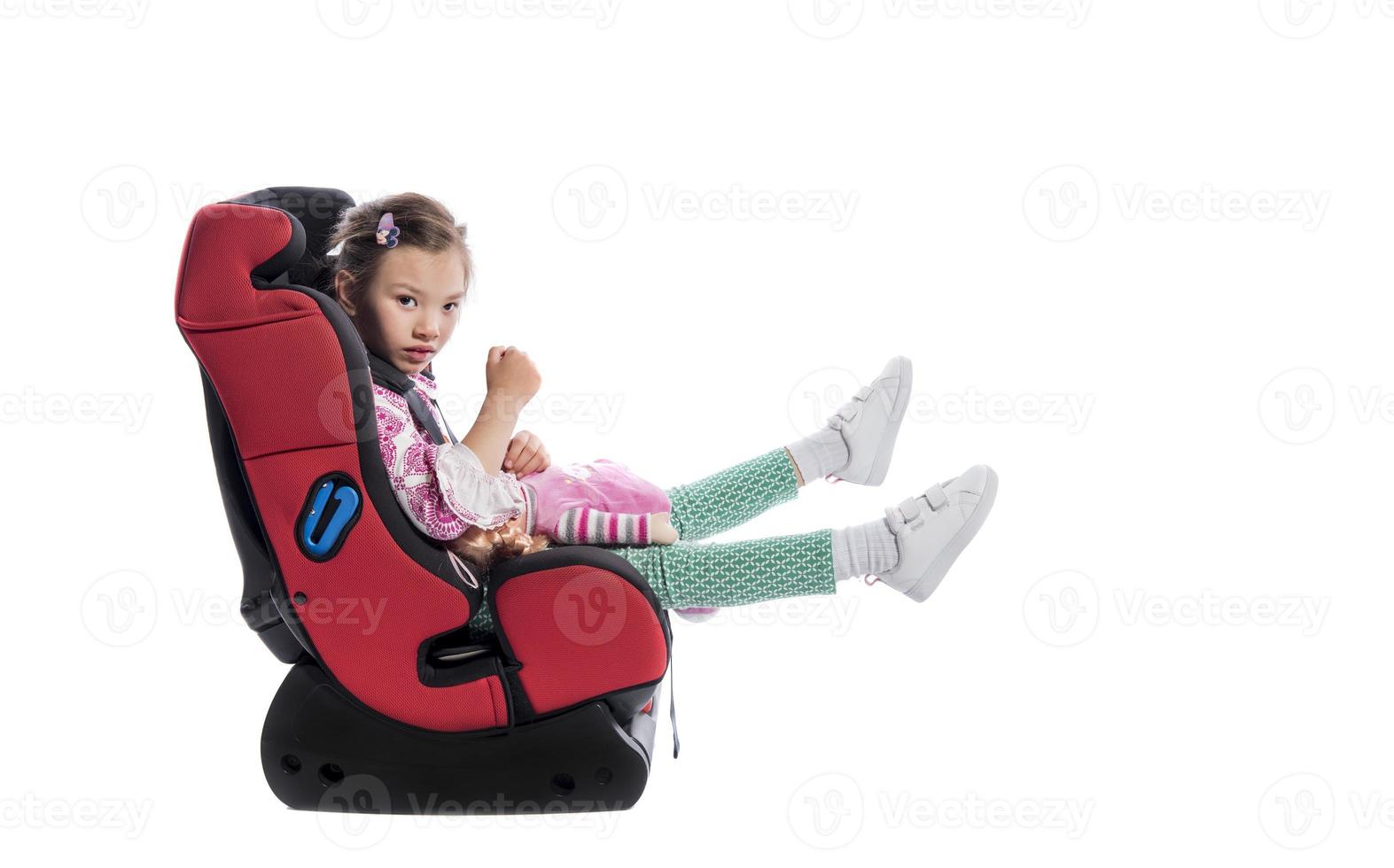 A little girl in a car seat photo