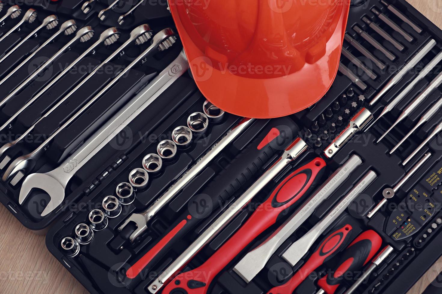 Toolbox, tools kit detail and orange protective helmet close up. instruments. set of tools. car tool kit. tool set background. instruments for repair. photo