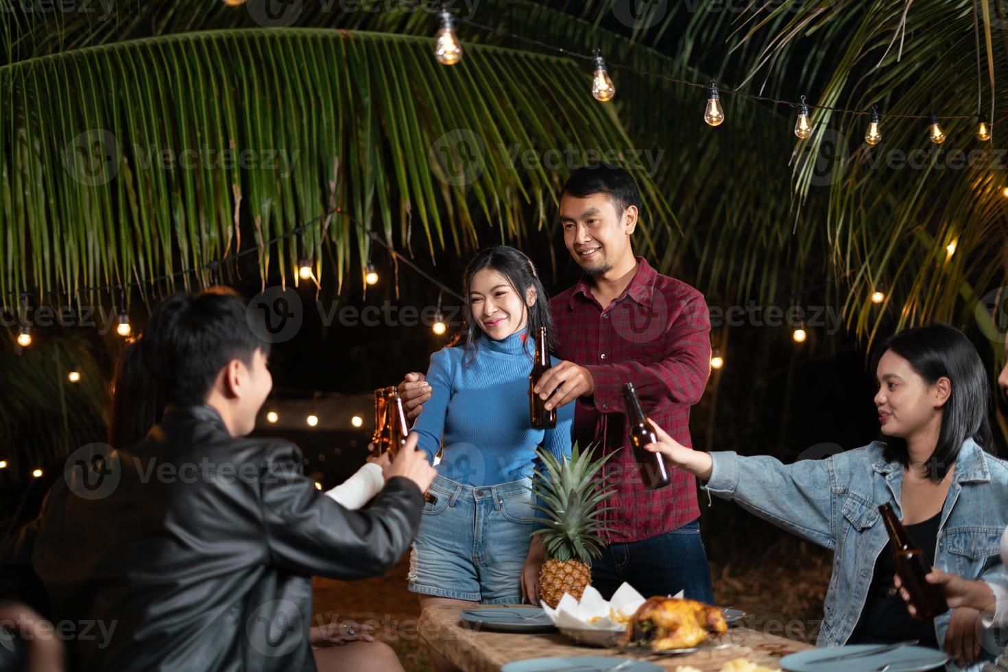 Young couple and friends get together for a holiday party. photo