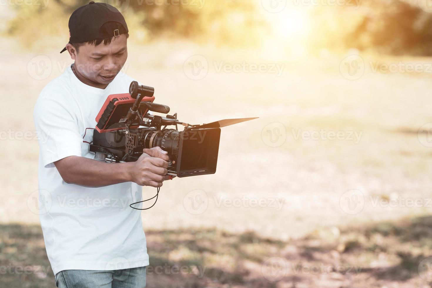 Asian cinematographers operate camera cinematic shoot and content creator use camera cinematic photo