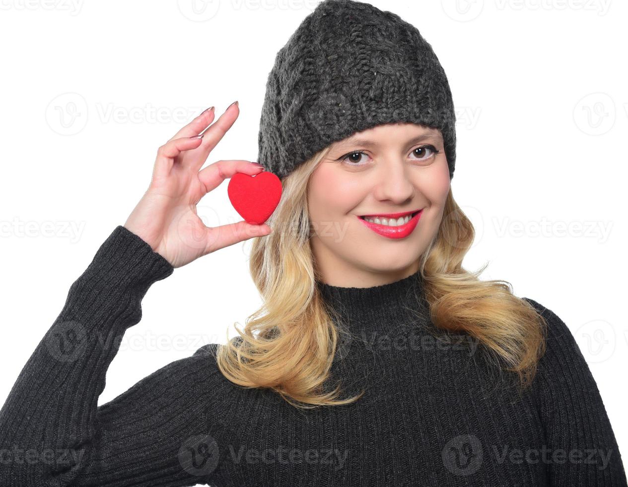 Cute attractive young woman with red heart. Valentine's day art portrait. photo