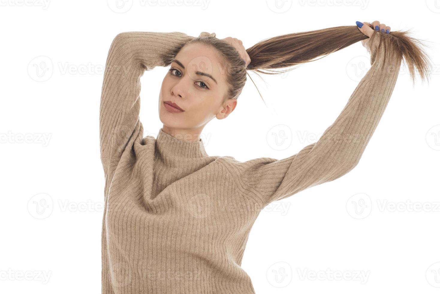 Portrait of a gorgeous young brunette woman with healthy hair. photo