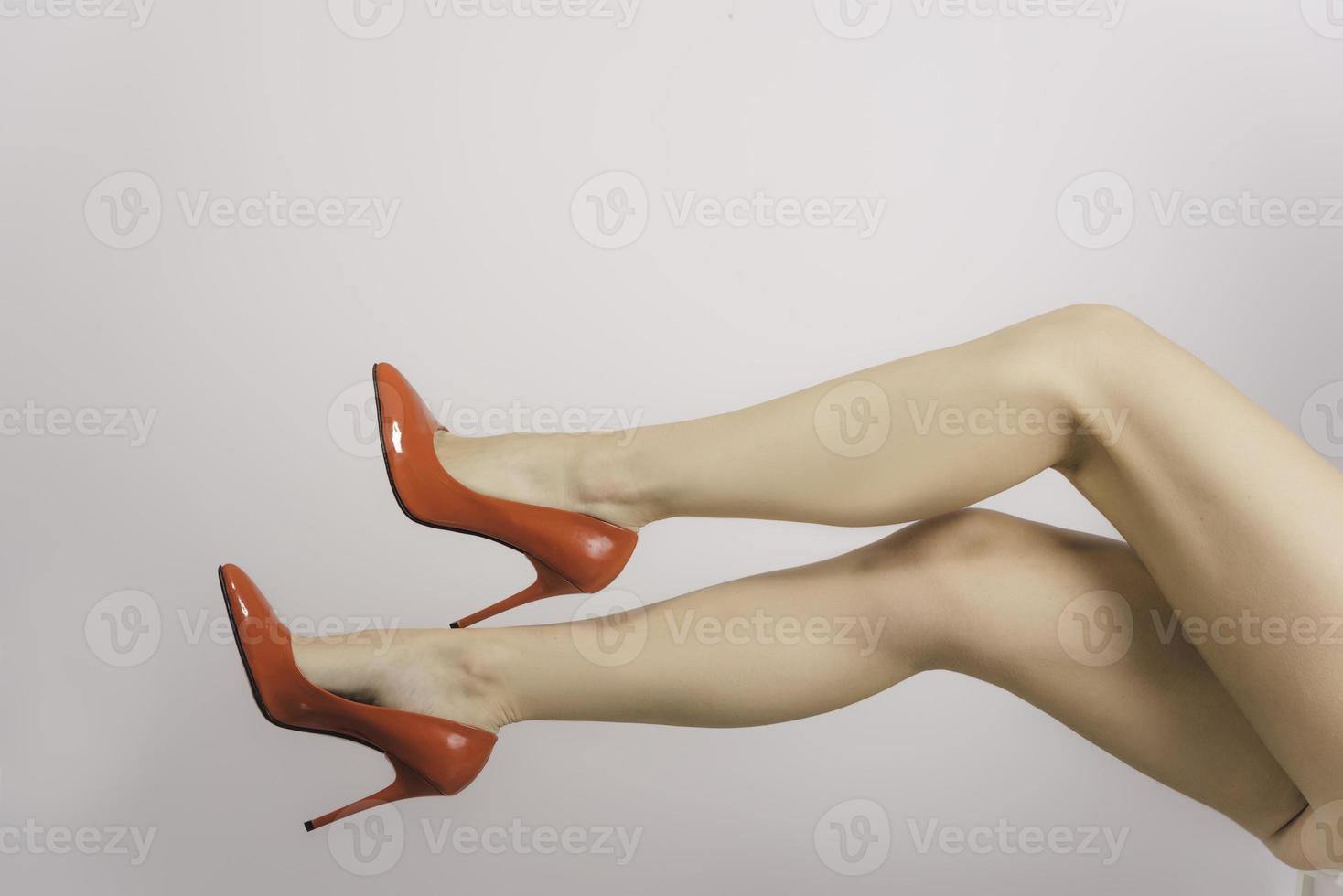 legs with red high hill shoes photo