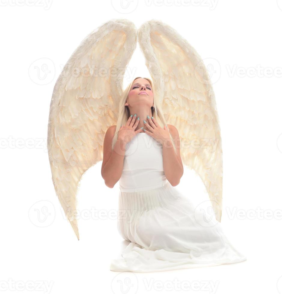 Portrait of beautiful blonde woman with angel's wings. Angel with long curly hair photo
