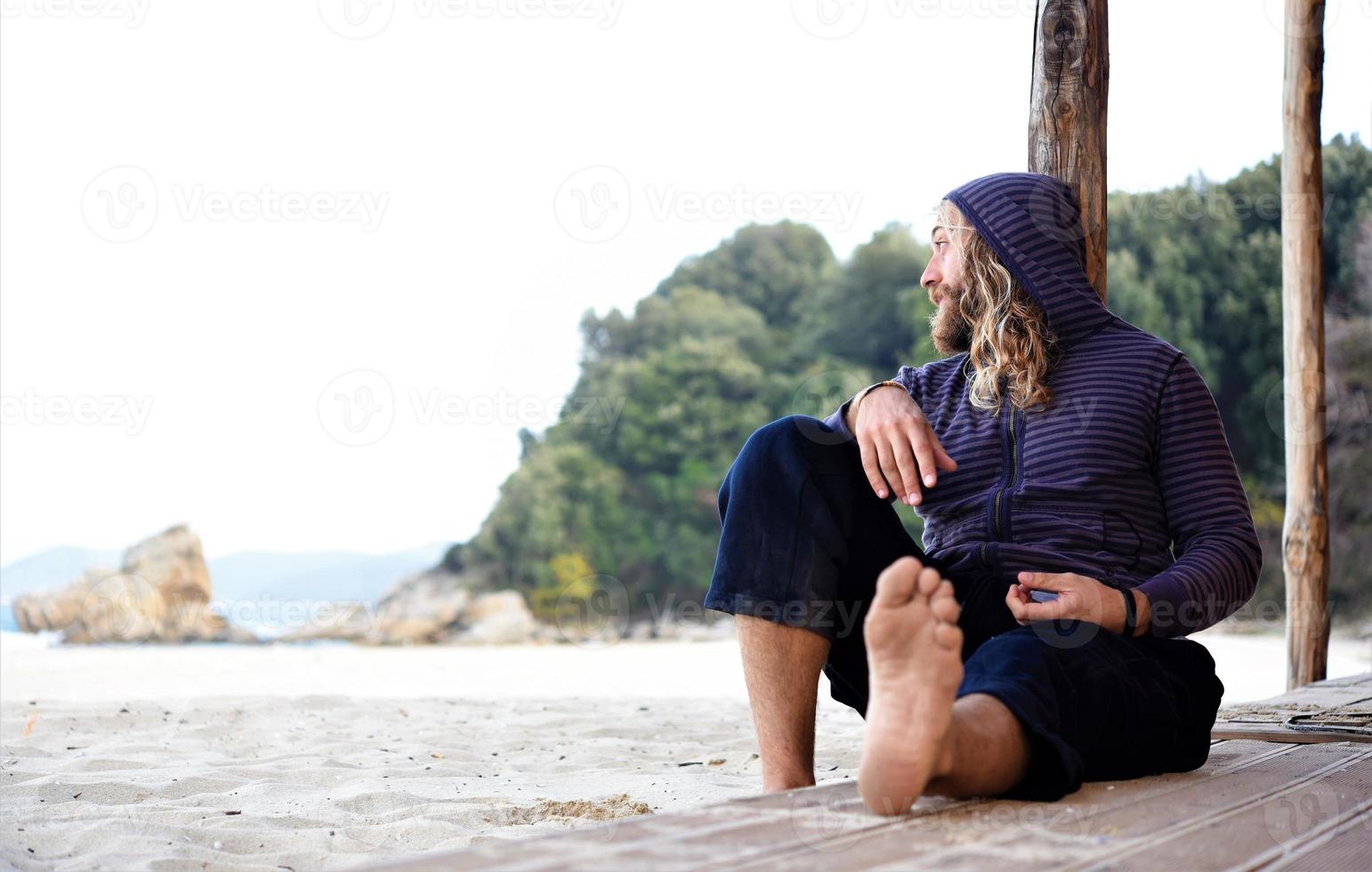 Man relaxing at beach photo