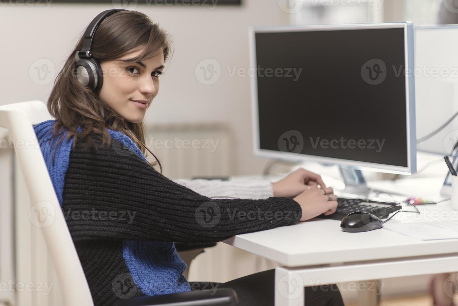 Two partnerships developing programming and coding technologies working on laptop and analyzing together. photo