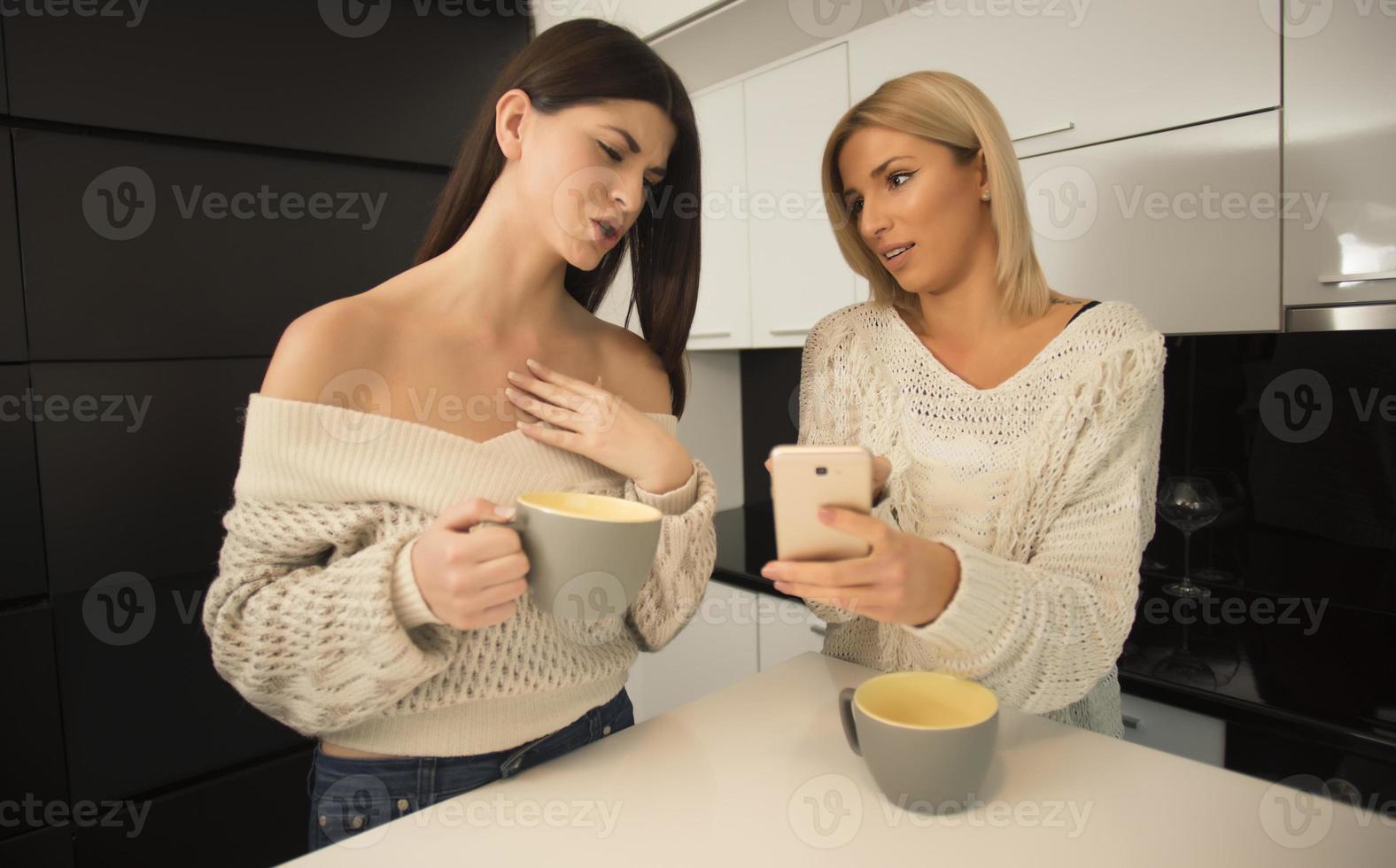 A young sexy lesbian couple enjoying intimate moments in a relaxed atmosphere photo