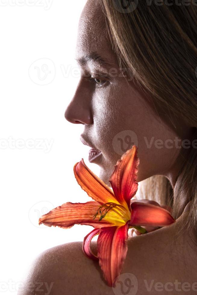 rtistic portrait of a female holding lily flower. Beauty concept.  isolated on white background photo