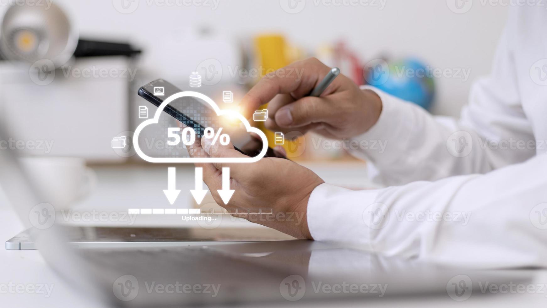 Cloud storage technology concept. Businessmen use laptops to synchronize documents or data to online storage. Upload and download files. Data sharing and transfer network. photo