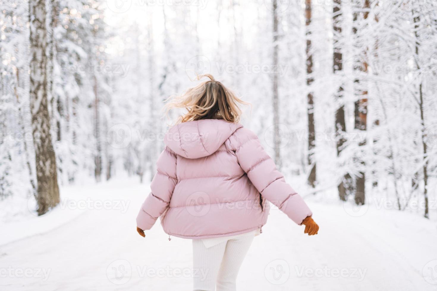 Full body portrait of young woman walking in snowy winter park wearing blue  coat, knitted warm clothes. Female fashion for cold weather Stock Photo -  Alamy