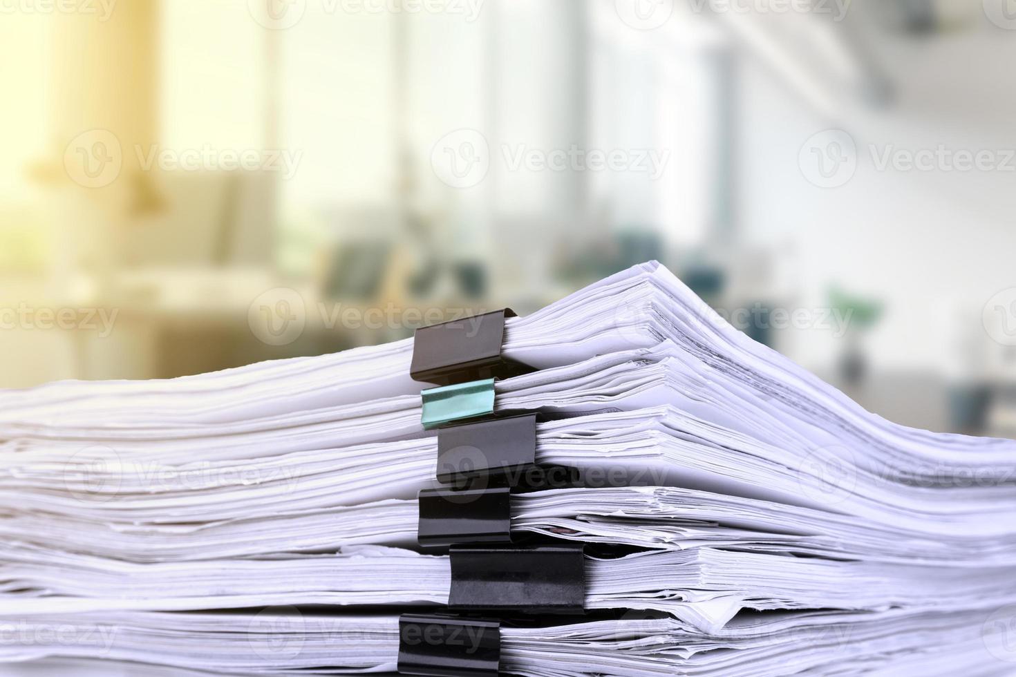 Stacks of papers on the desk in the office. business office photo