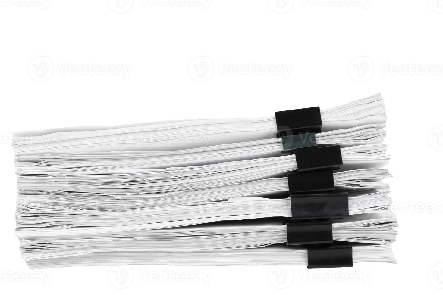Stack of papers with paper clips, office folders. White isolated background. photo