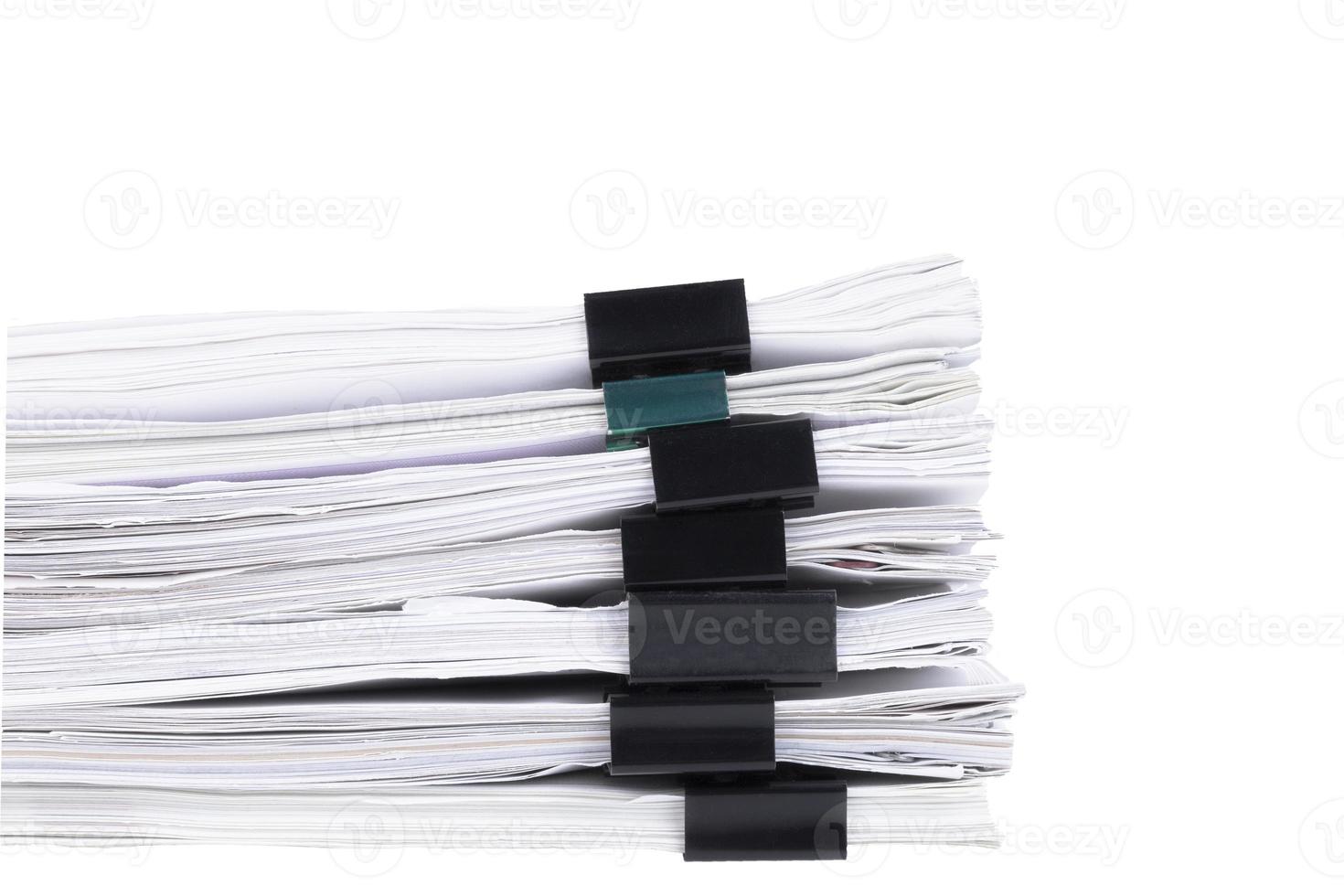 Stack of papers with paper clips, office folders. White isolated background. photo