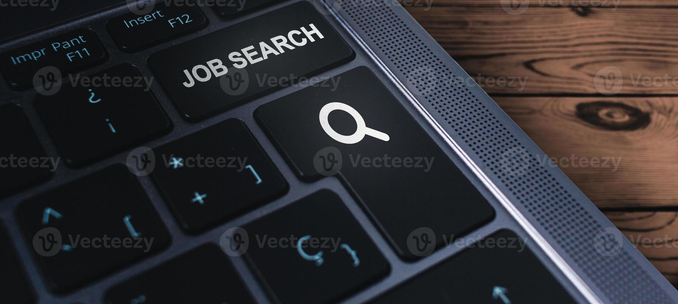 Banner of laptop keyboard with the words job search on buttons. Find your career. Using online website to find a job. photo