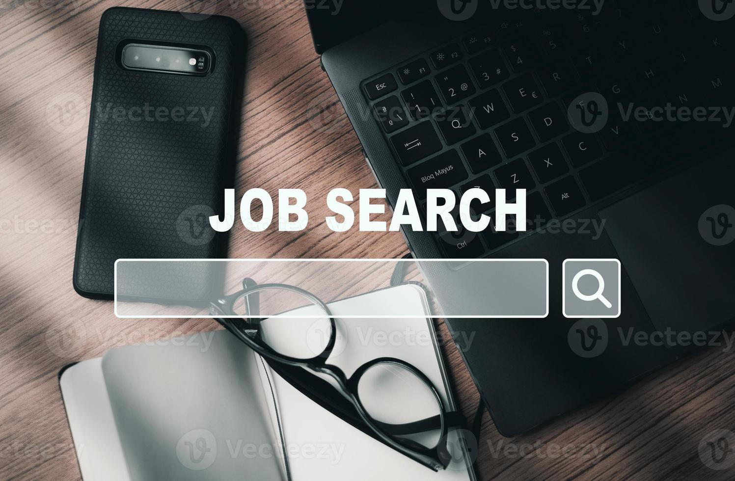 Flat lay image of desktop with VR browser to search a job. Find your career. Using online website to find a job. photo