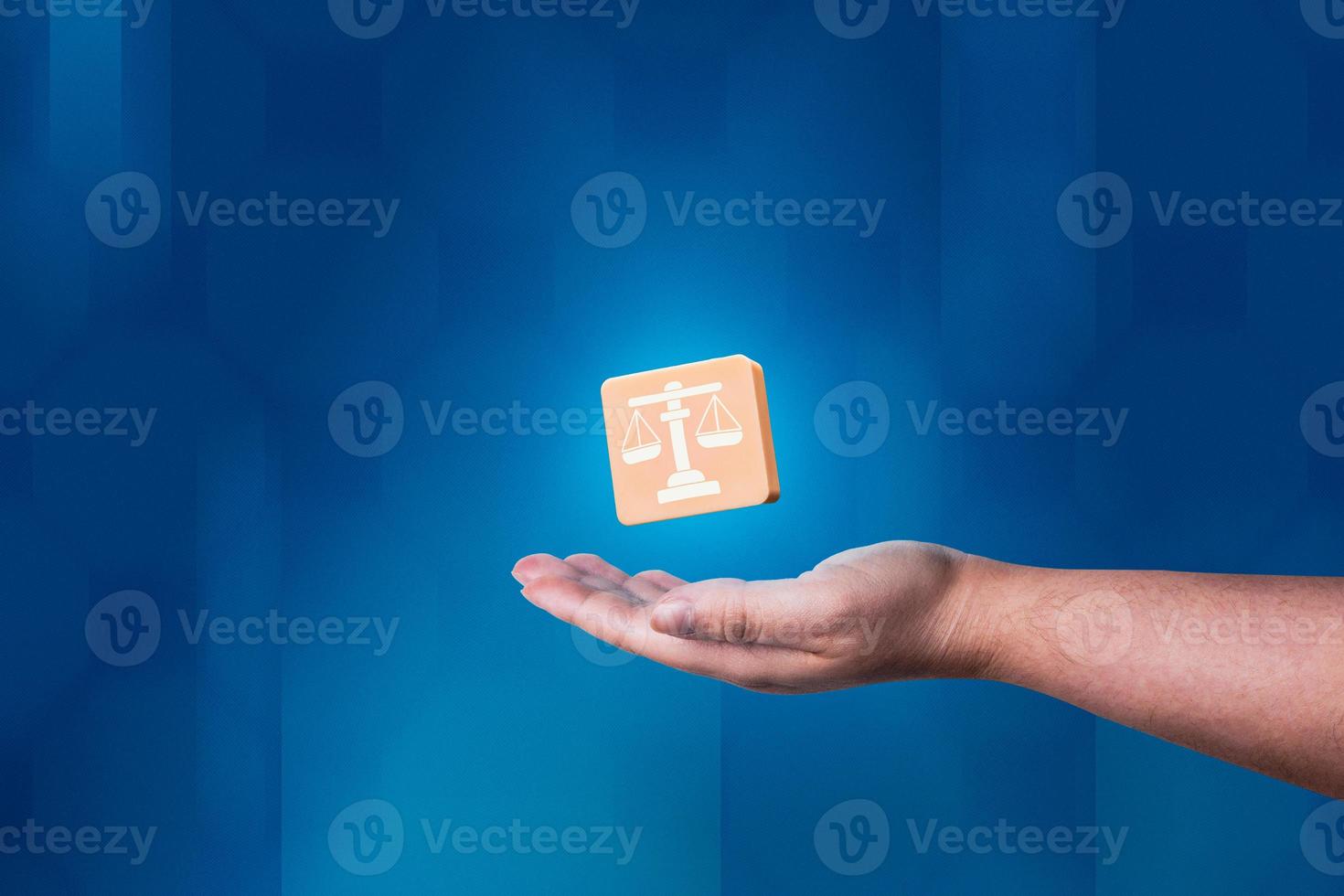 Woman hand showing balance justice icon with modern blue background. Legal advice technology service concept. Law and defense. photo