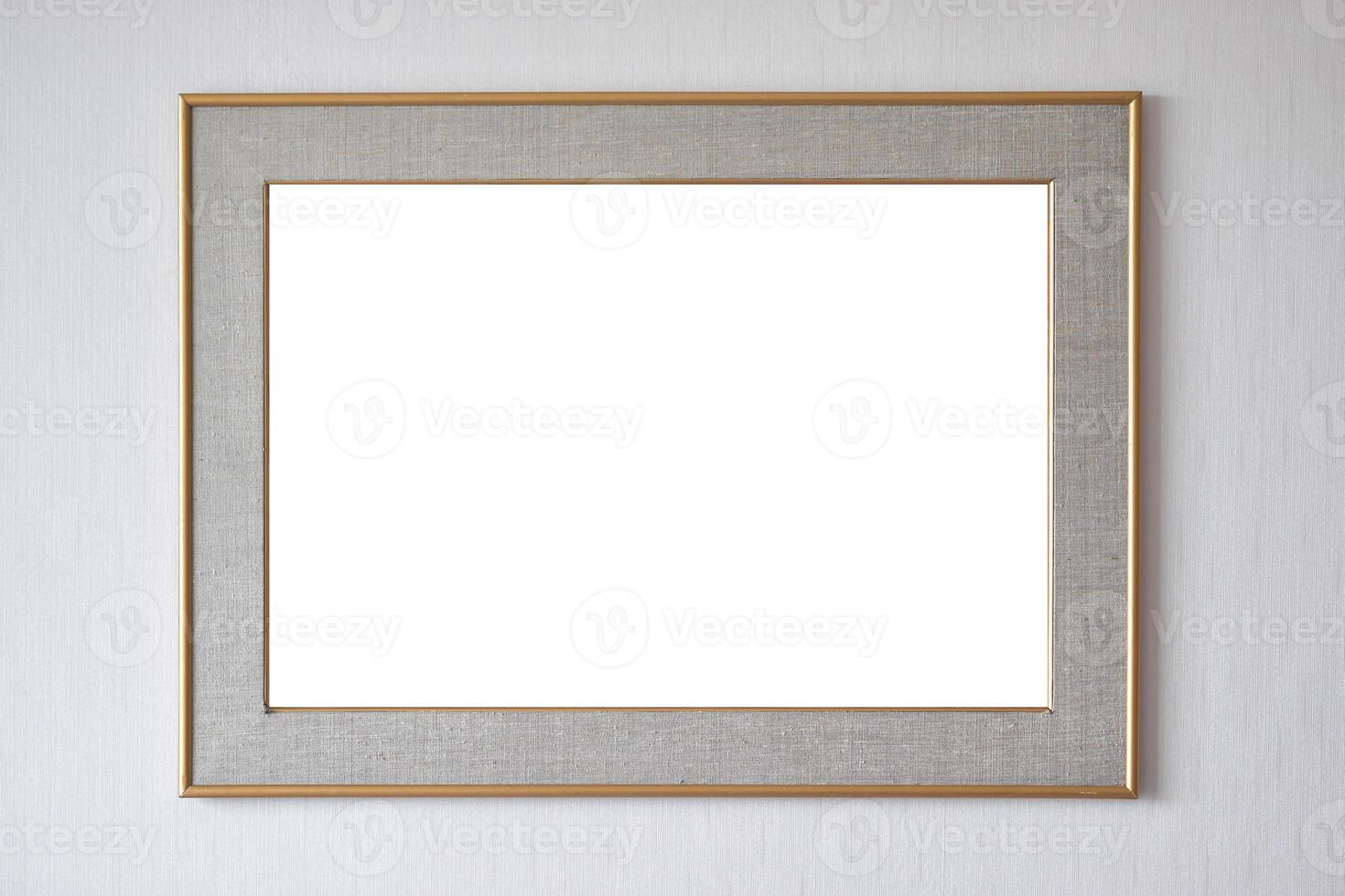 Blank picture frame hanging on wall photo