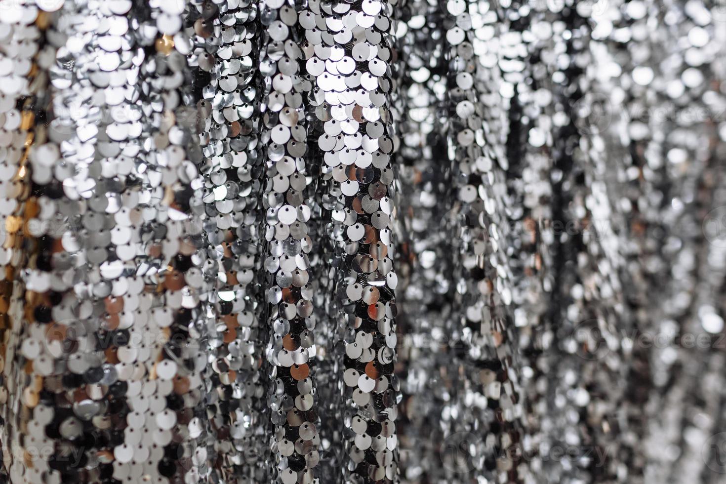 A close overhead view of silver sequins photo