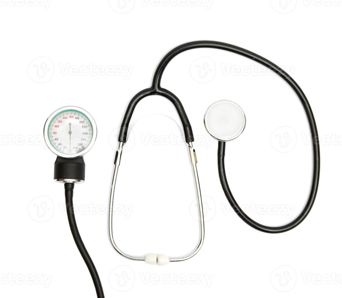 Medical Concept with stethoscope, blood pressure gauge isolated on white. Copy Space. Close up view photo