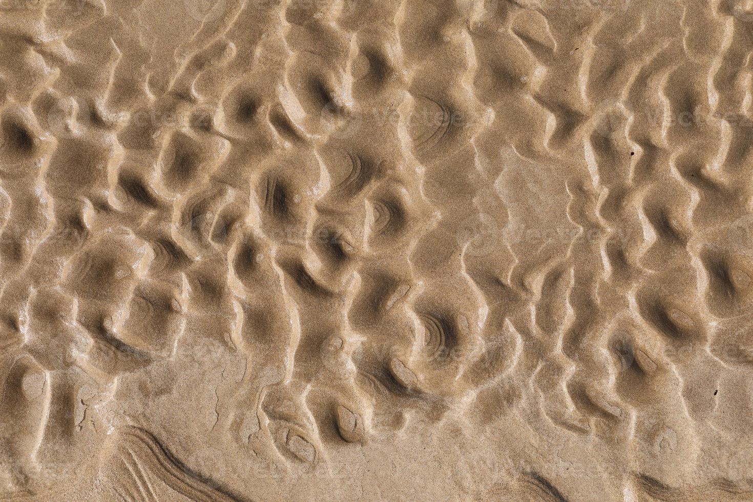 Natural sand patterns on the beach at low tide.copy space. photo