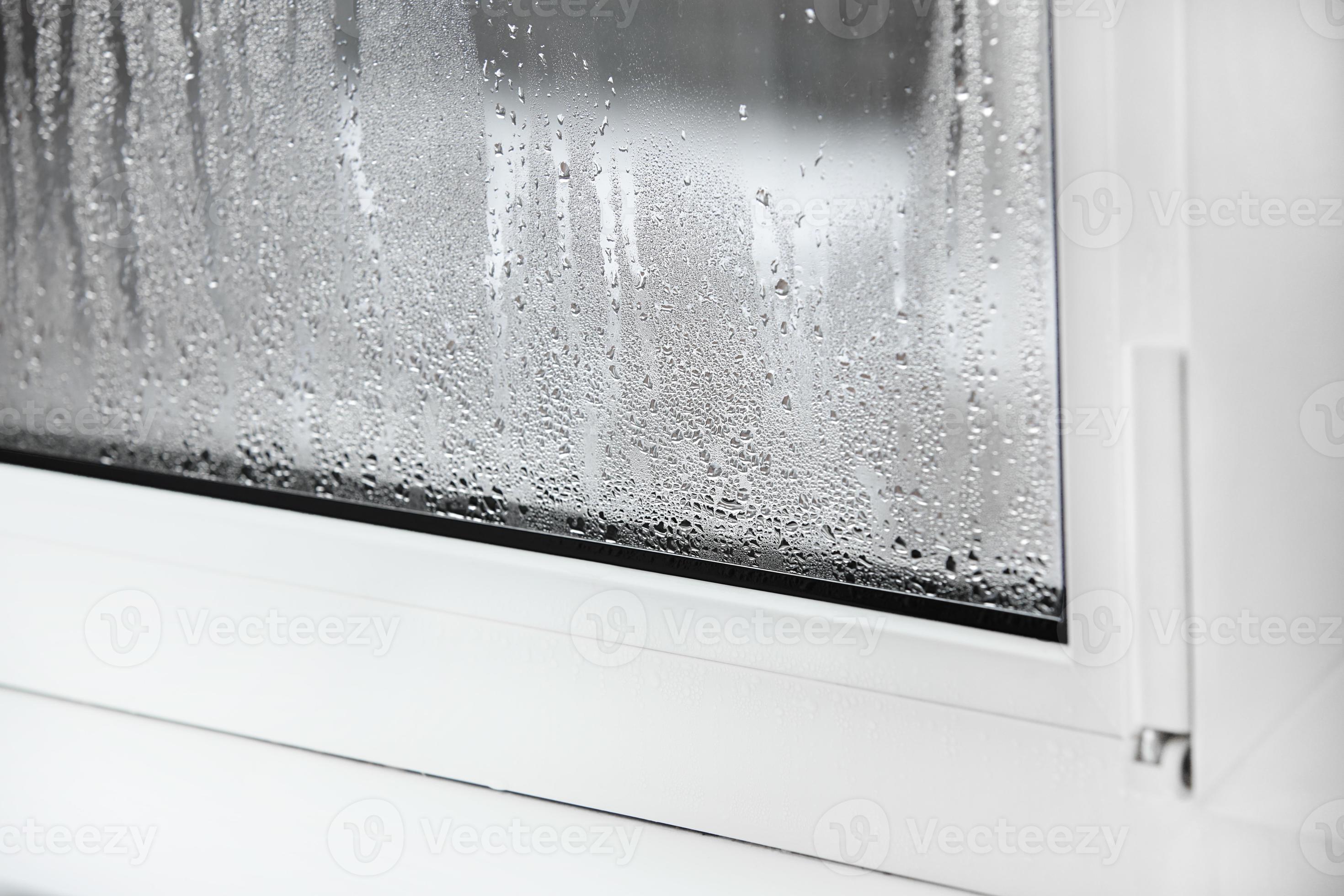 a plastic window with condensation of water on the glass. Double glazed PVC window. Concept