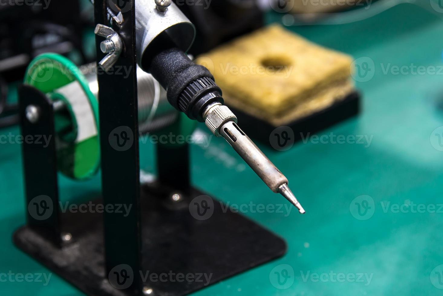 soldering iron and tin string photo