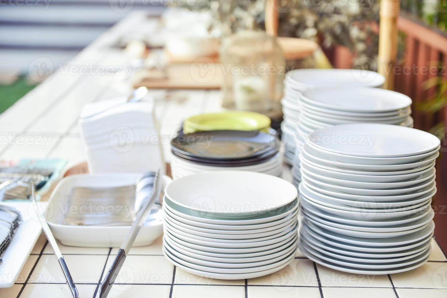 Plates layer on Buffet table photo